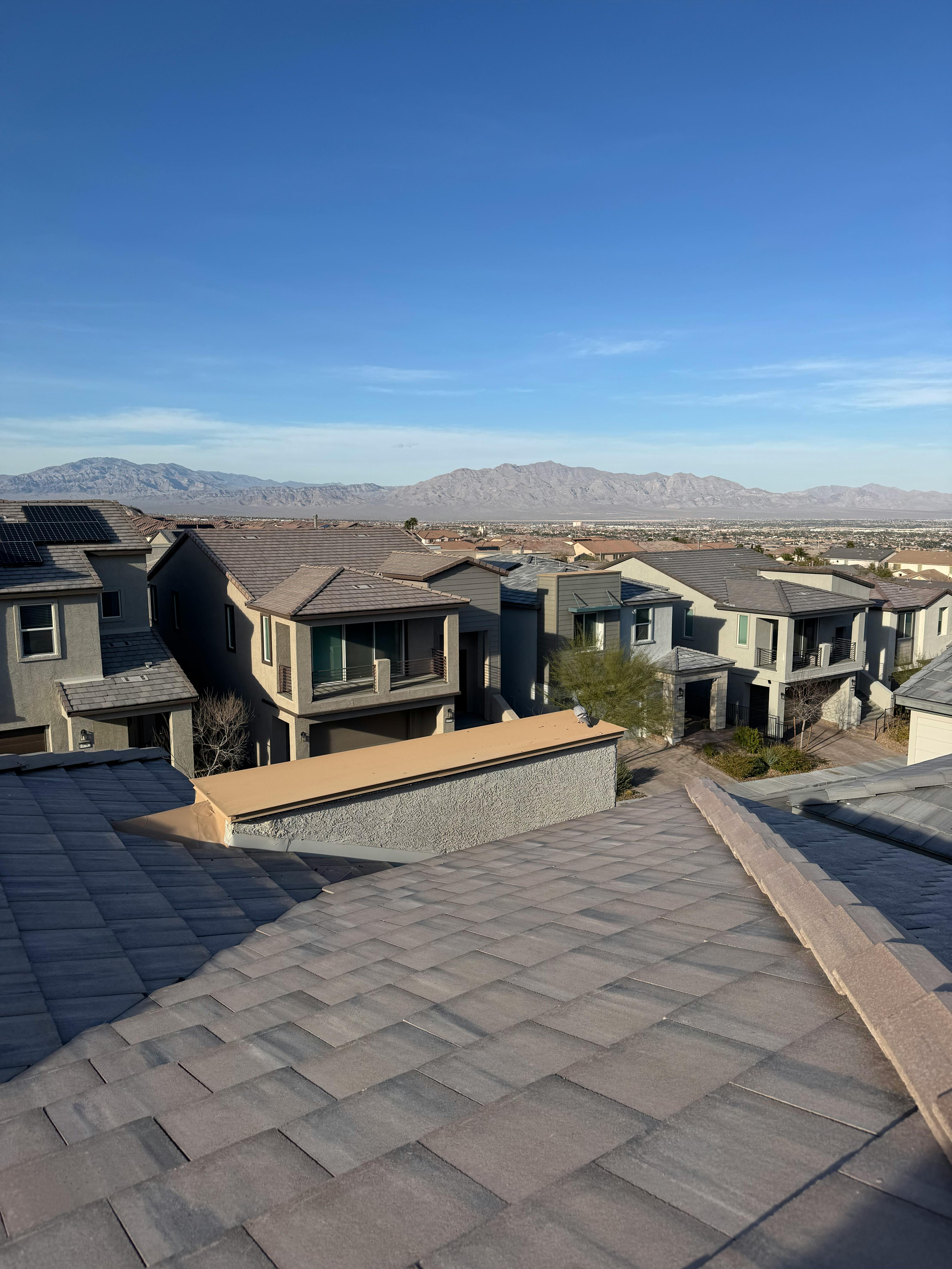 Roofer at work on a residential roof